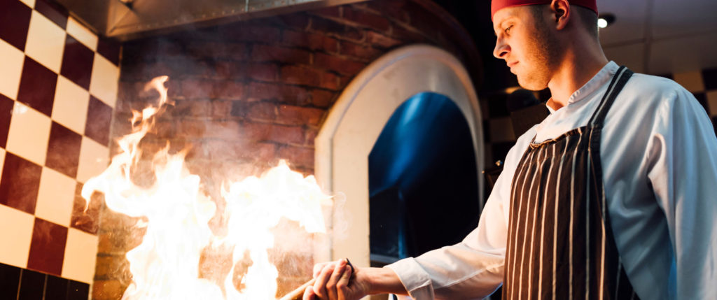 Chef cooking in a Frankie & Benny's kitchen